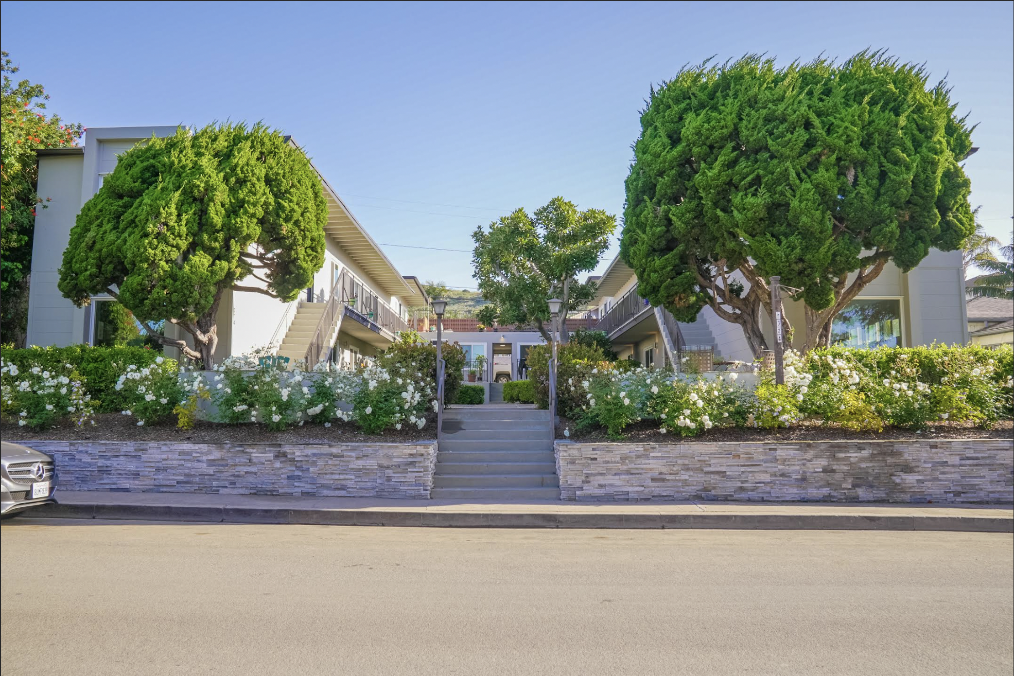 Tree-lined walkway at a Southern California multifamily property