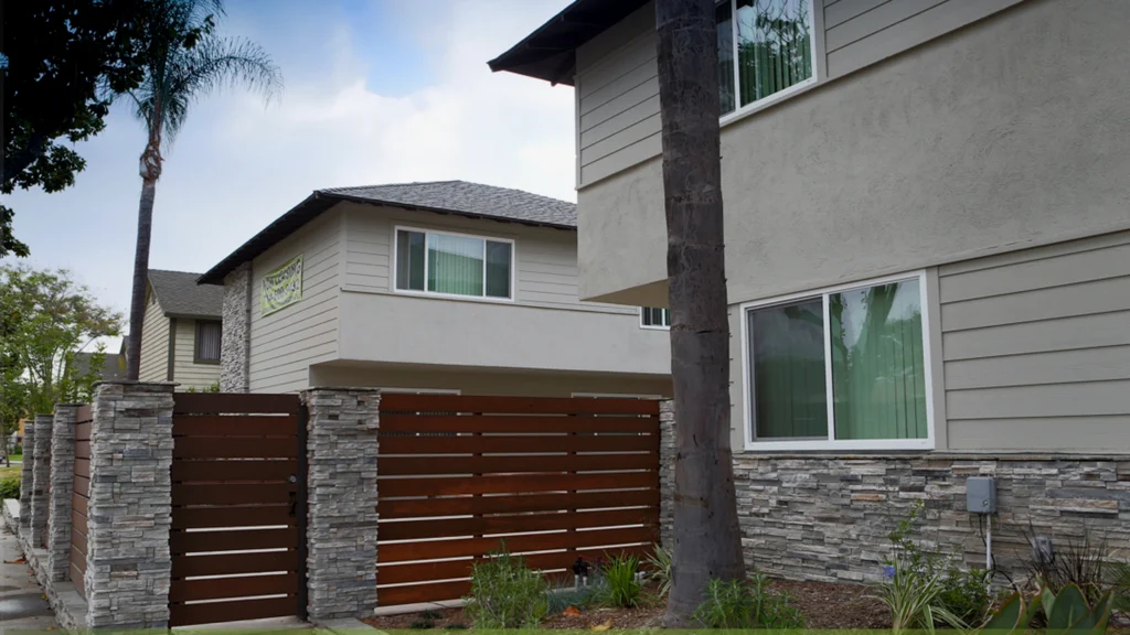 Multifamily building exterior evaluated before comparing acquisition assumptions